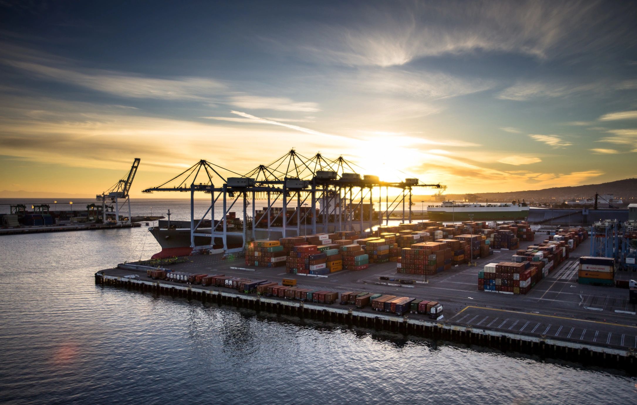 Container port logistics scene, representing international shipping coordination